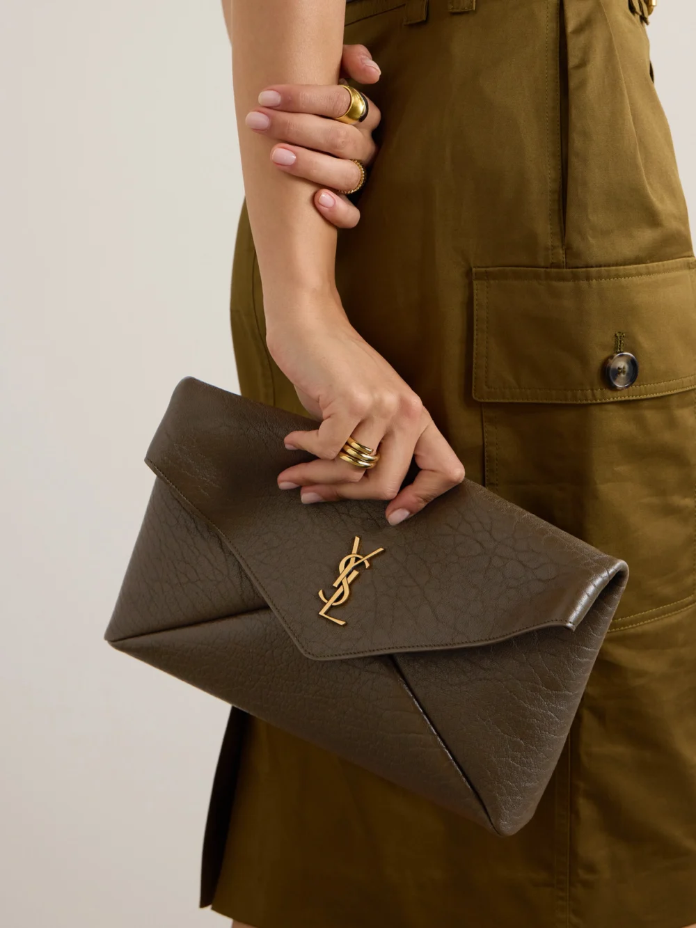 Saint Laurent Cassandre Large Textured-leather Clutch, styled view