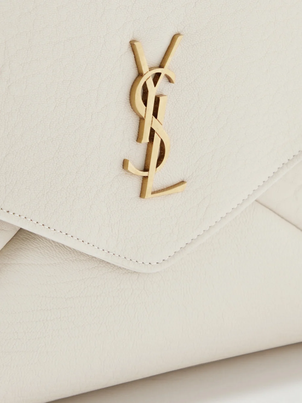 Close-up detail of the Saint Laurent Cassandre Large Textured-leather Clutch