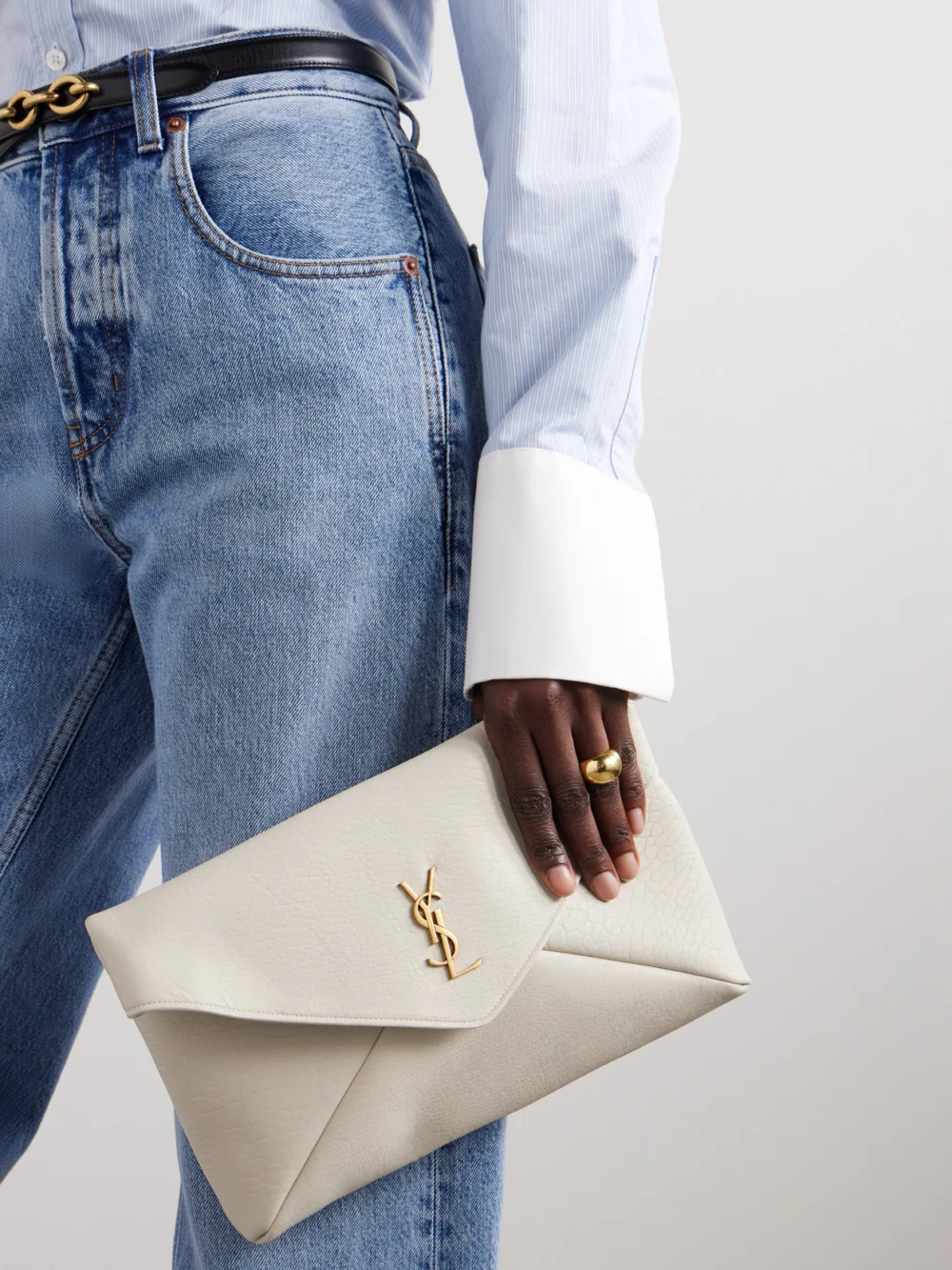 Saint Laurent Cassandre Large Textured-leather Clutch, styled view