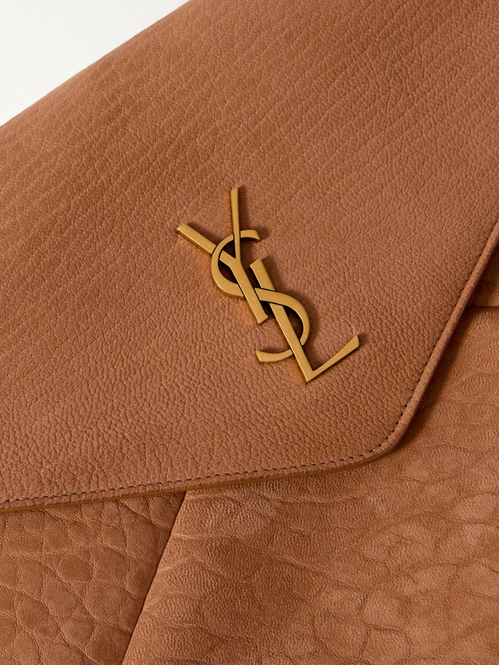 Close-up detail of the Saint Laurent Cassandre Large Textured-nubuck Clutch