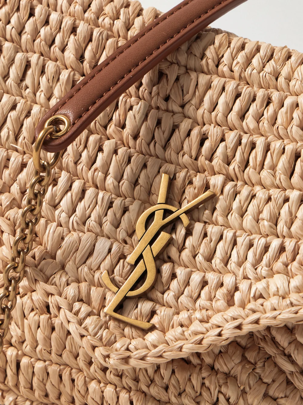 Close-up detail of the Saint Laurent Cassandre Leather-trimmed Raffia Shoulder Bag