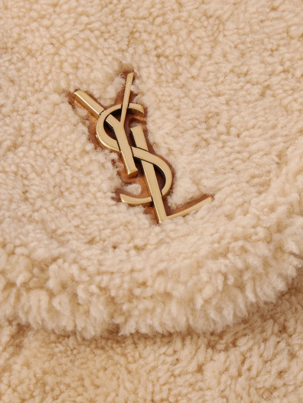 Close-up detail of the Saint Laurent Cassandre Leather-trimmed Shearling Shoulder Bag