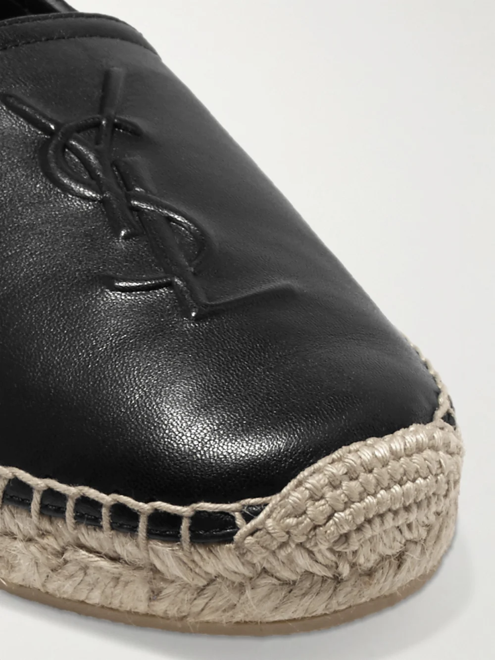 Close-up detail of the Saint Laurent Cassandre Logo-embossed Leather Espadrilles