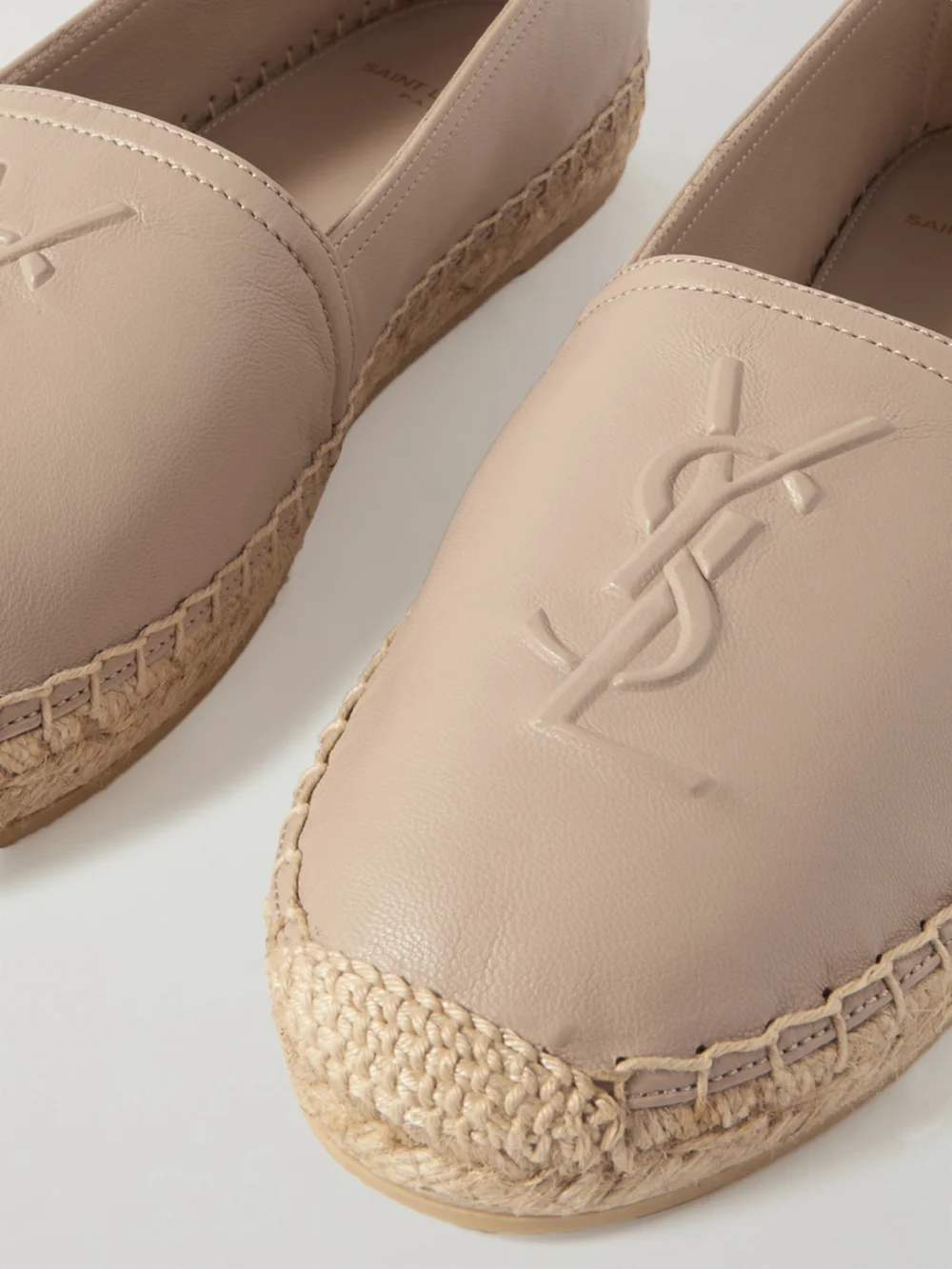 Close-up detail of the Saint Laurent Cassandre Logo-embossed Leather Espadrilles
