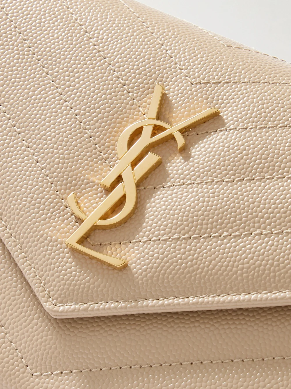 Close-up detail of the Saint Laurent Cassandre Matelassé Textured-leather Shoulder Bag