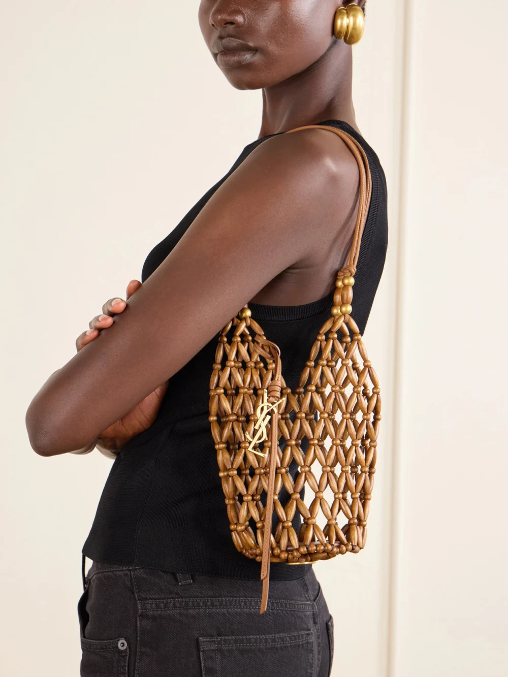 Saint Laurent Cassandre Mini Beaded Wood Bucket Bag, styled view