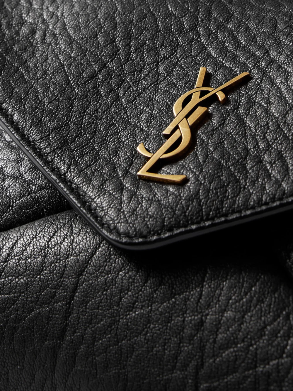 Close-up detail of the Saint Laurent Cassandre Textured-leather Shoulder Bag