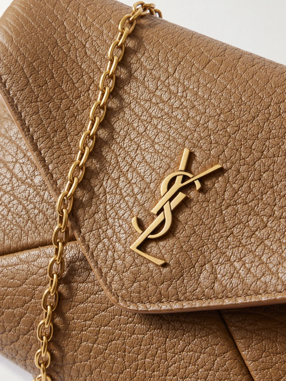Close-up detail of the Saint Laurent Cassandre Textured-leather Shoulder Bag