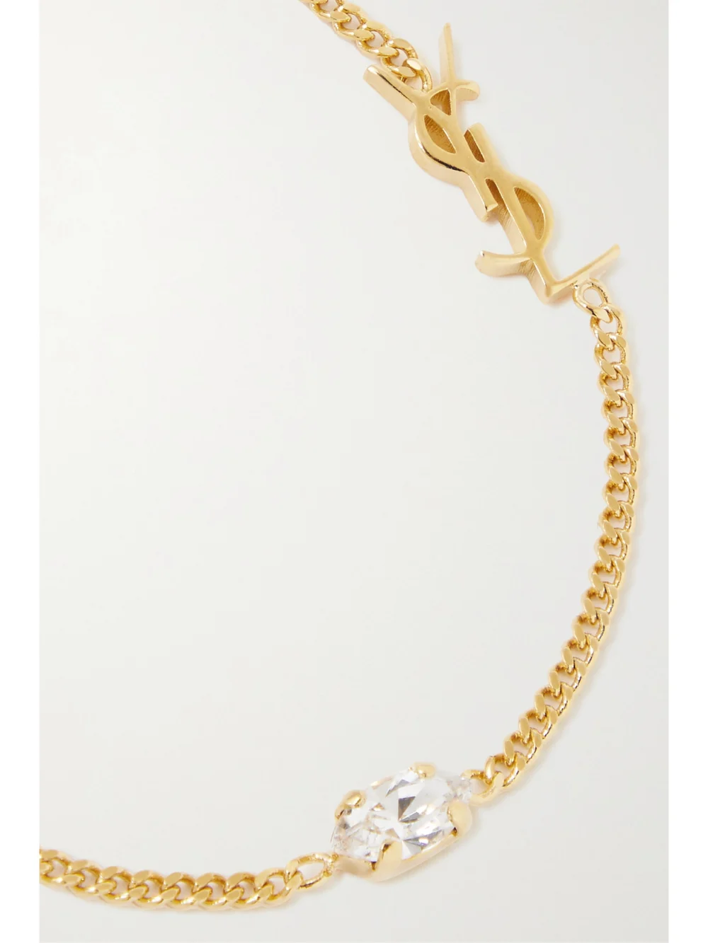Close-up detail of the Saint Laurent Crystal-embellished Gold-tone Bracelet