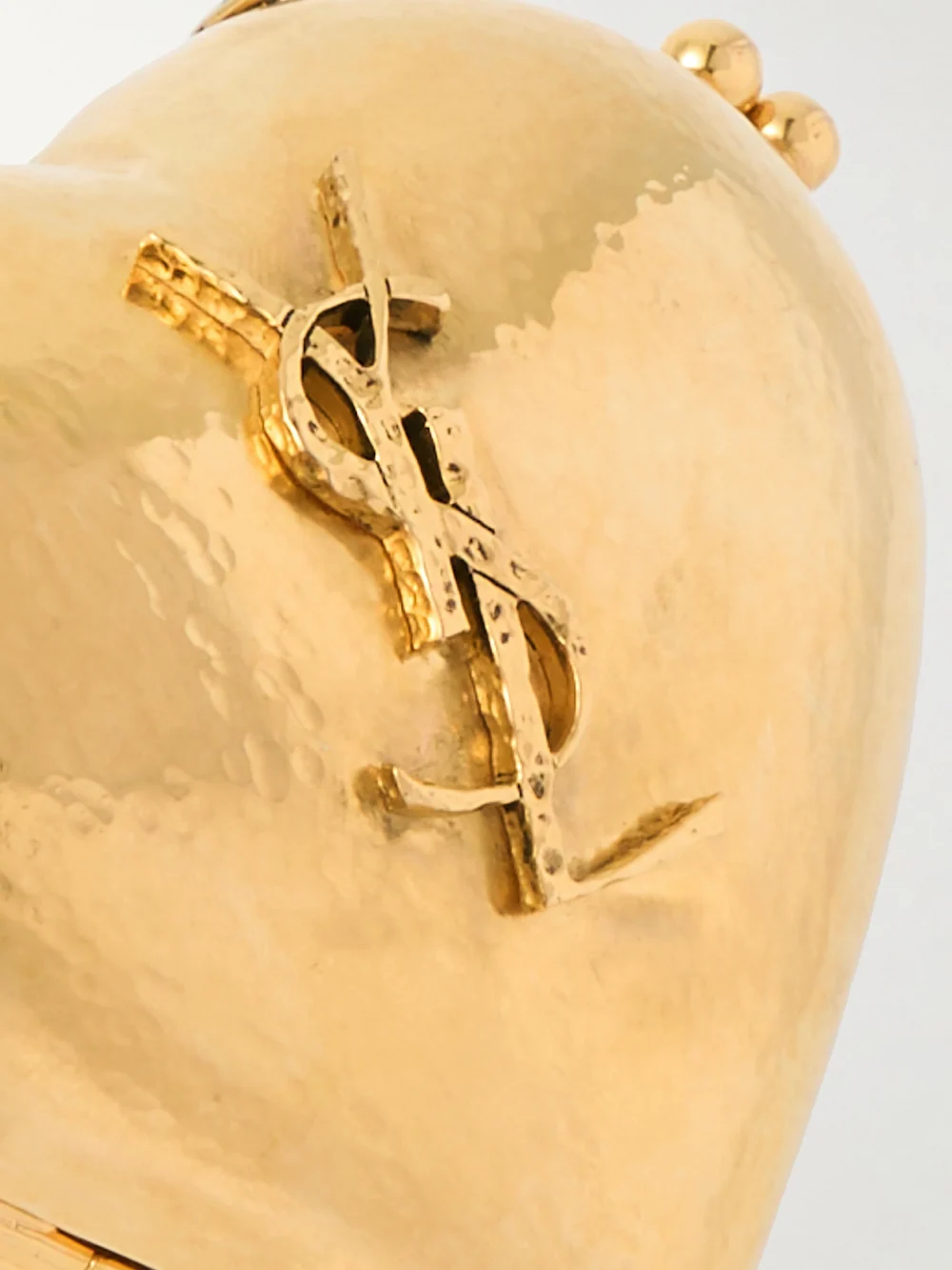 Close-up detail of the Saint Laurent Evening Gold-tone Clutch