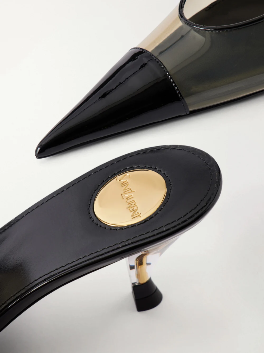 Close-up detail of the Saint Laurent Fanny 55 Patent Leather-trimmed Tpu Slingback Pumps