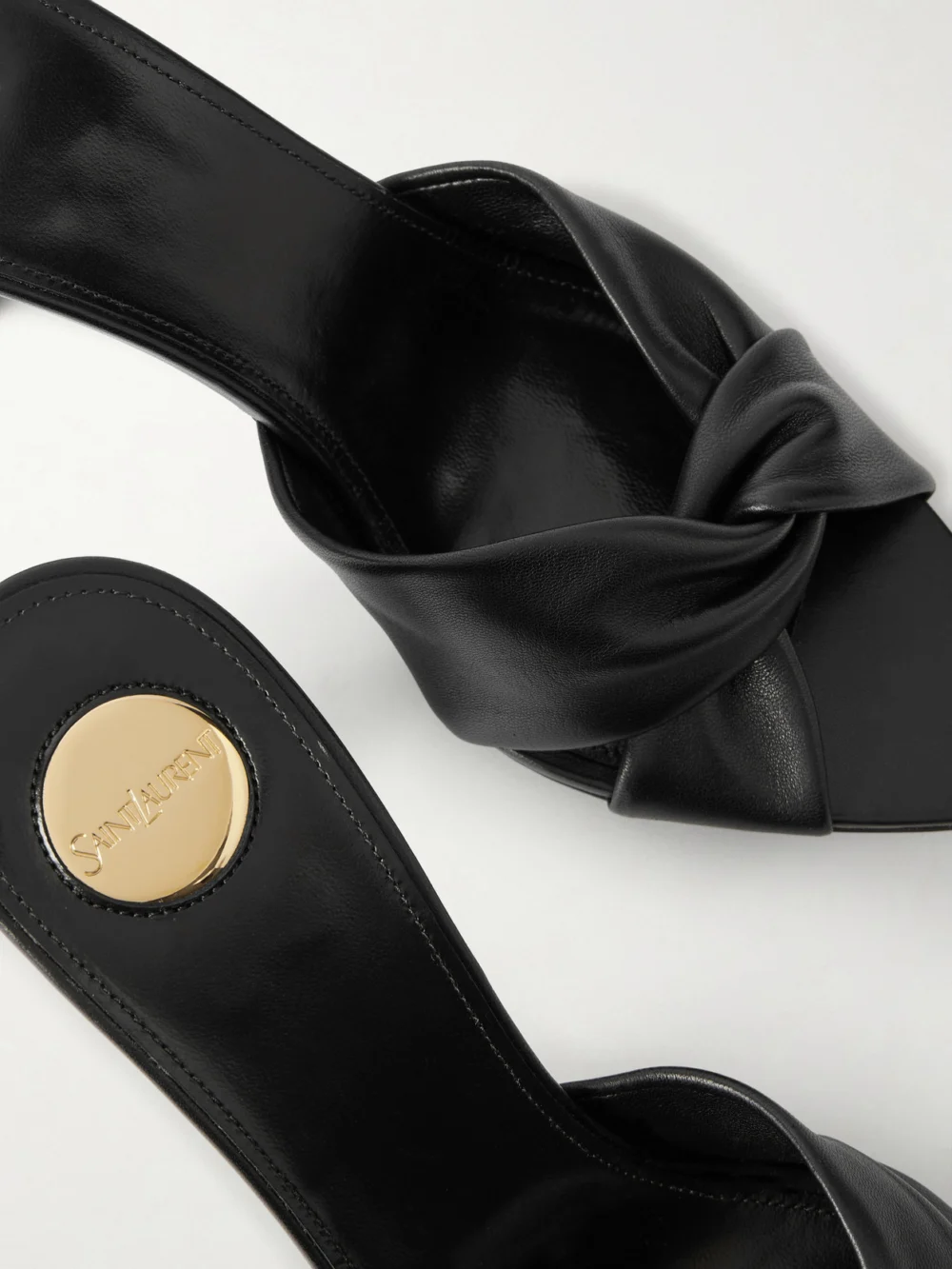 Close-up detail of the Saint Laurent Franciane Twisted Leather Mules
