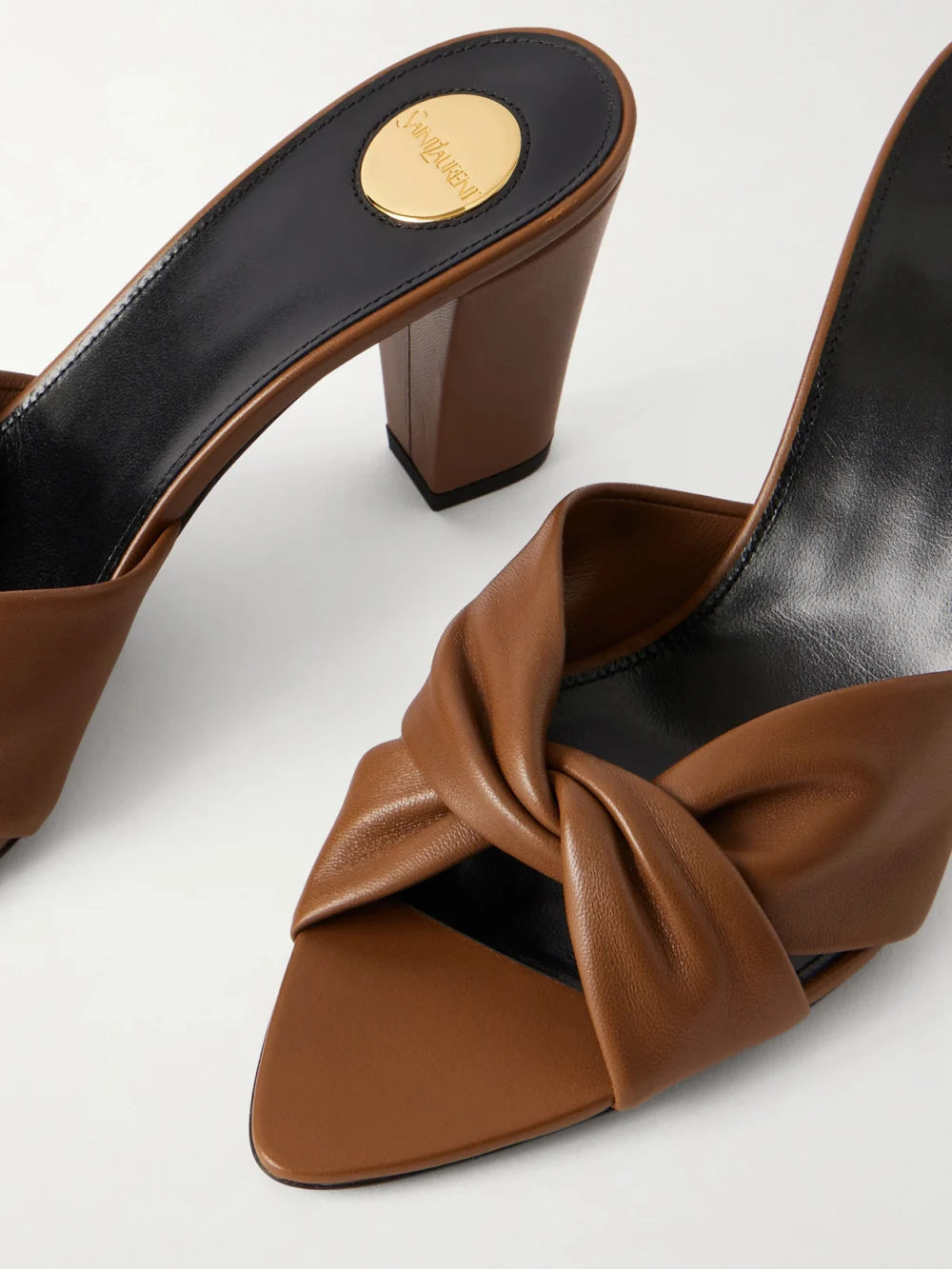 Close-up detail of the Saint Laurent Franciane Twisted Leather Mules
