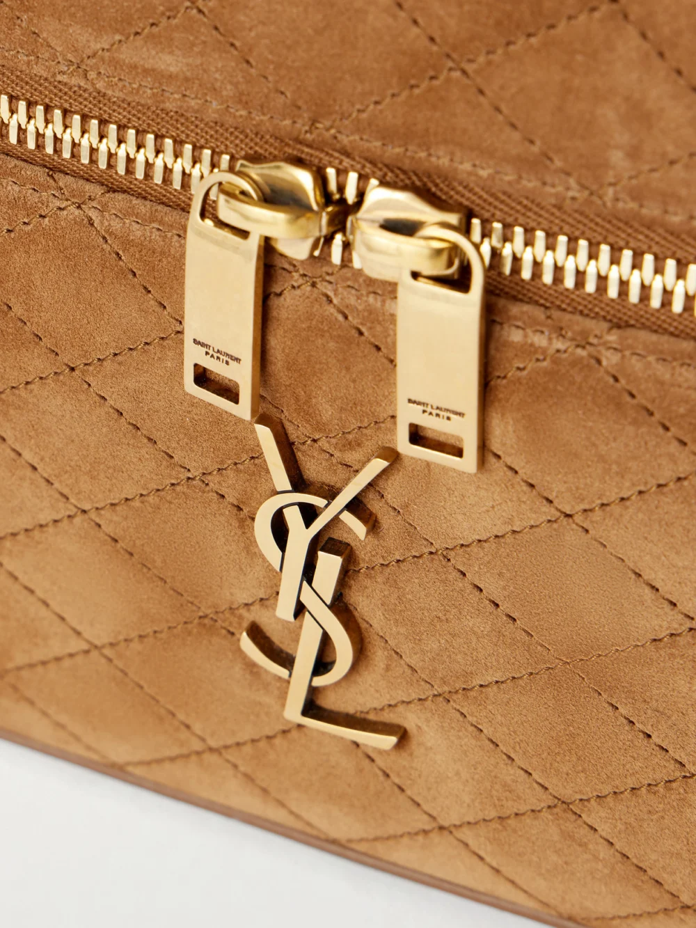 Close-up detail of the Saint Laurent Gaby Cassandre-embellished Quilted Suede Mini Bag