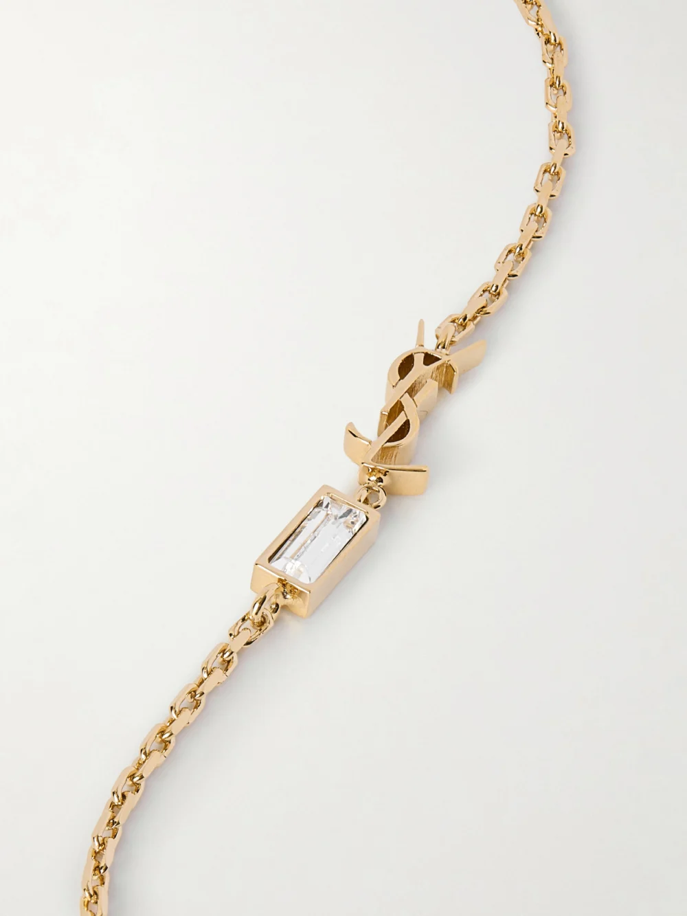 Close-up detail of the Saint Laurent Gold-tone and Crystal Bracelet