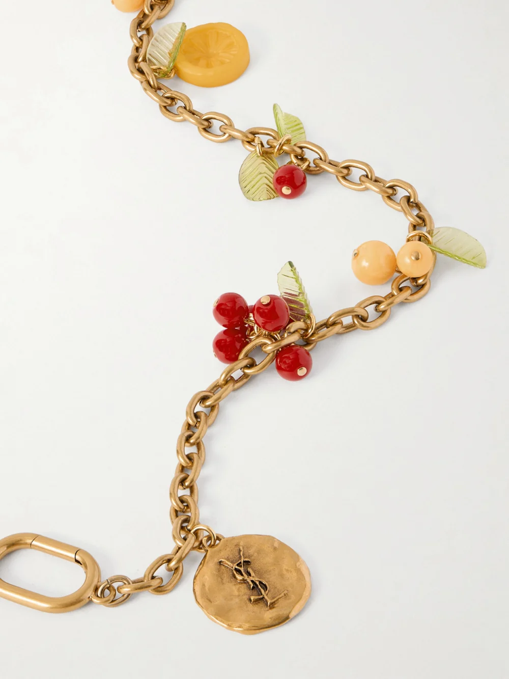 Close-up detail of the Saint Laurent Gold-tone and Resin Bag Charm