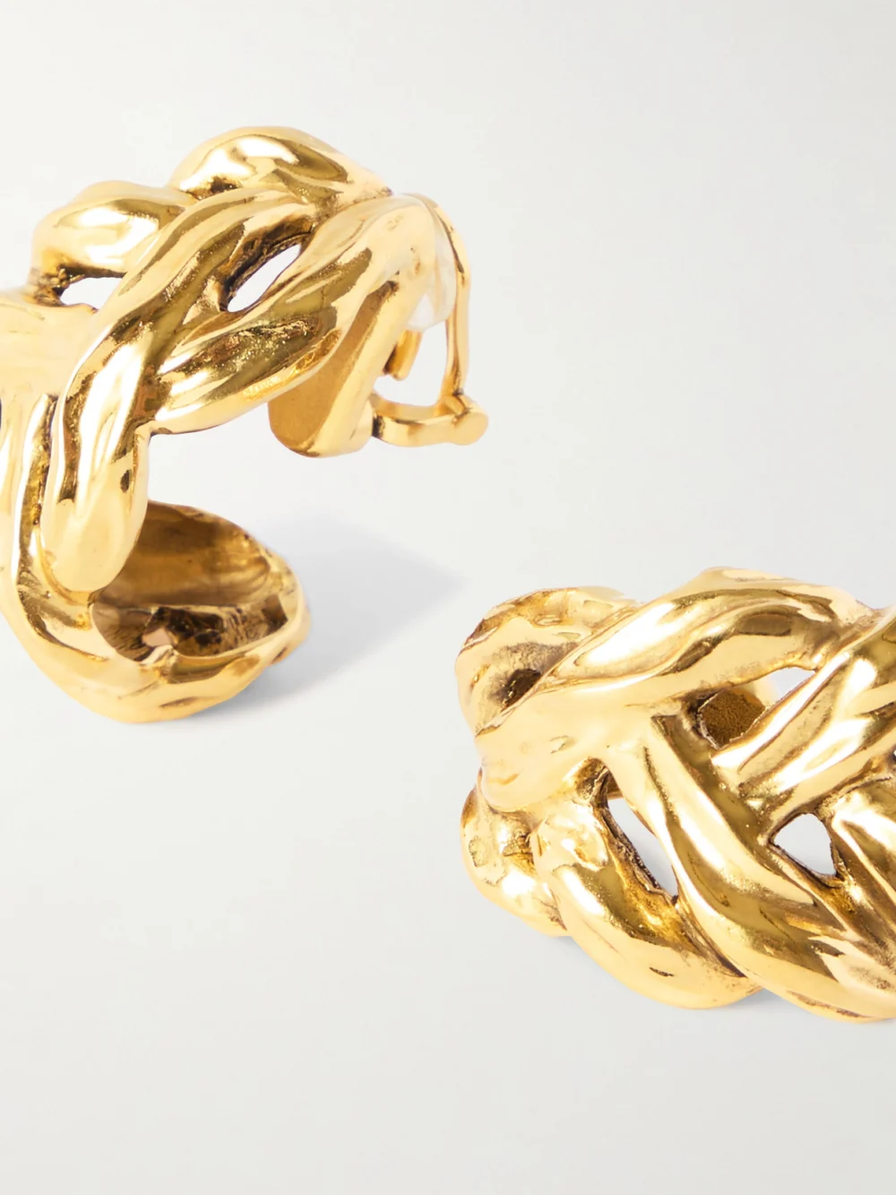 Close-up detail of the Saint Laurent Gold-tone Clip Earrings