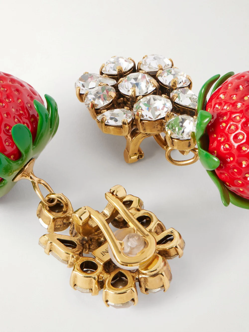 Close-up detail of the Saint Laurent Gold-tone, Crystal and Resin Clip Earrings