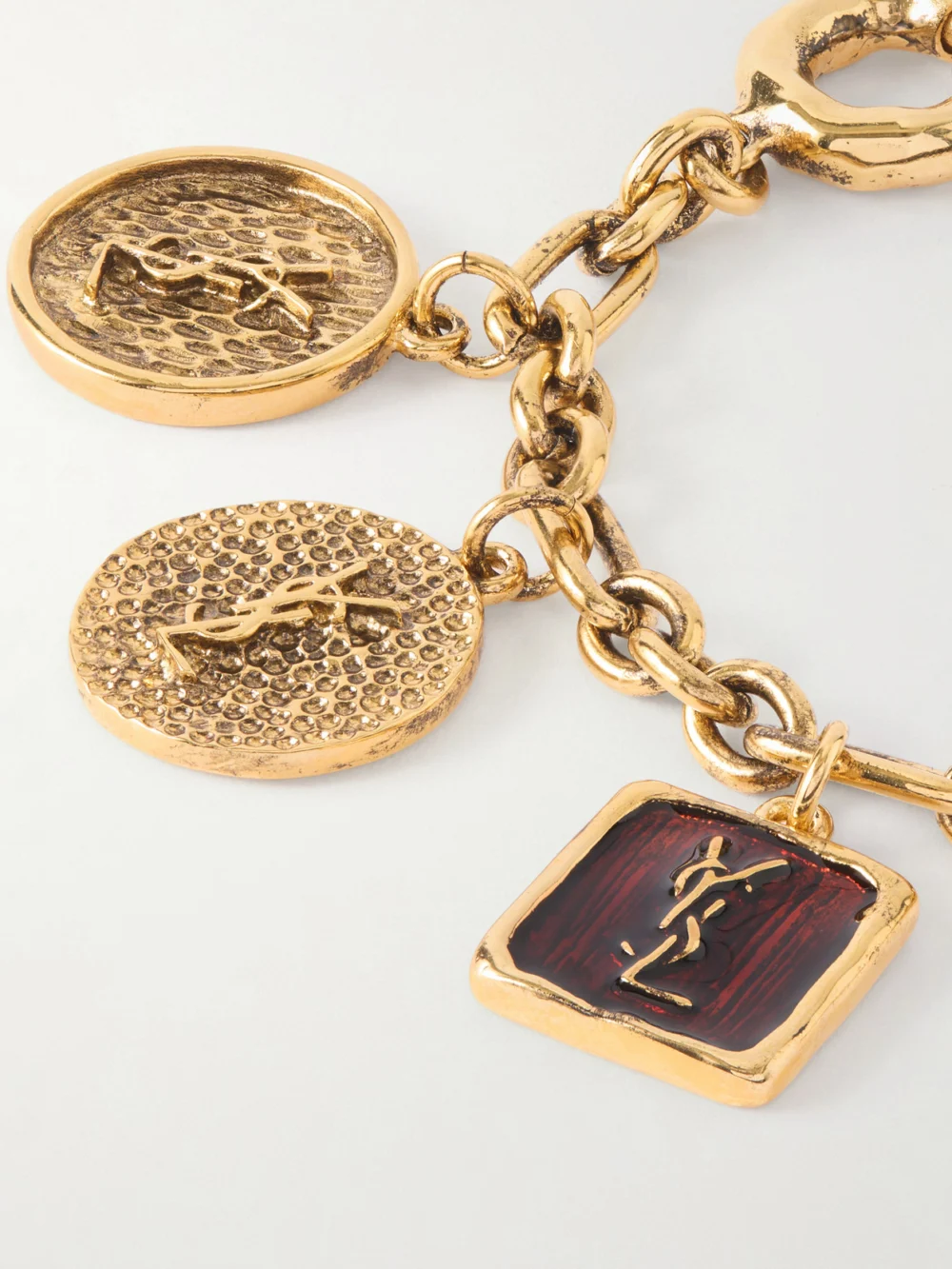 Close-up detail of the Saint Laurent Gold-tone Enamel Bracelet