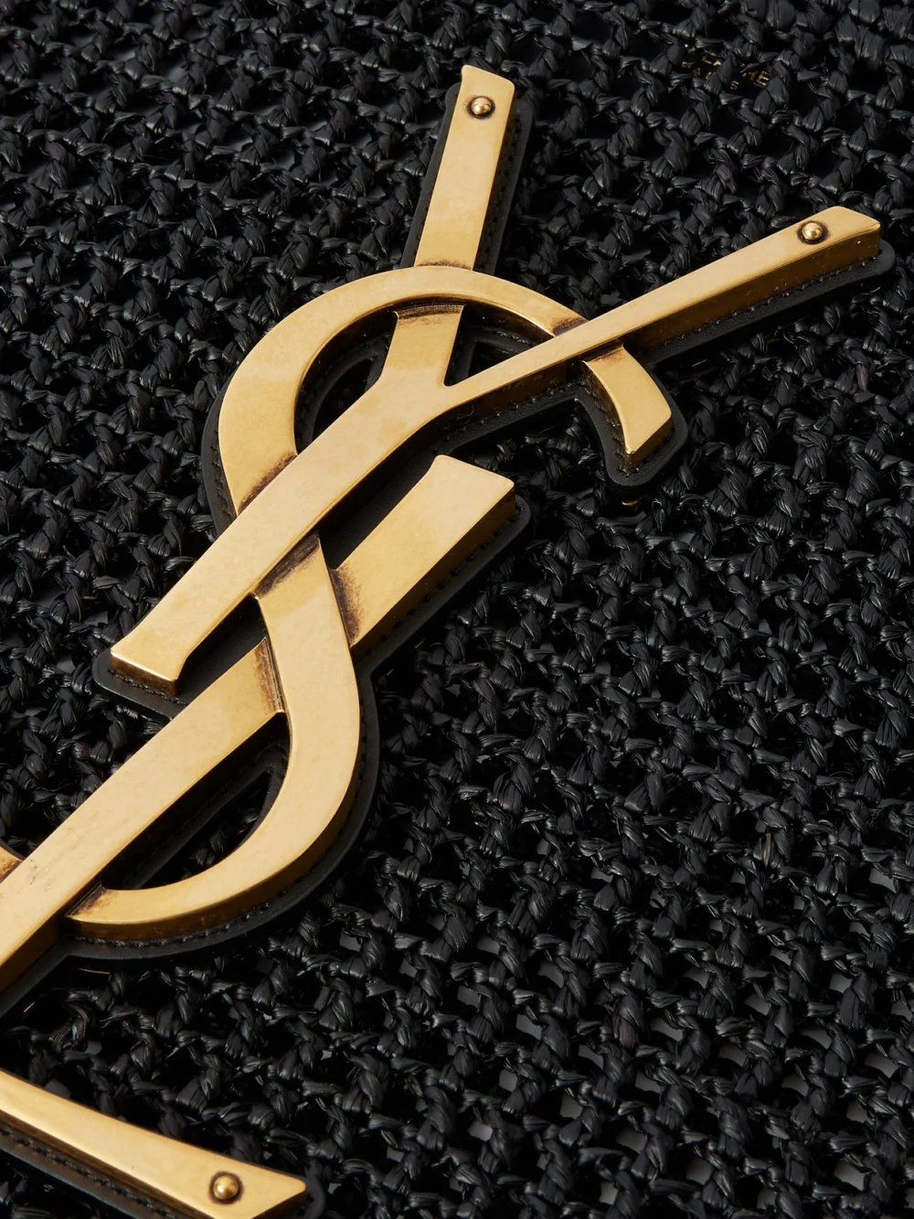 Close-up detail of the Saint Laurent Icare Maxi Leather-trimmed Raffia Tote
