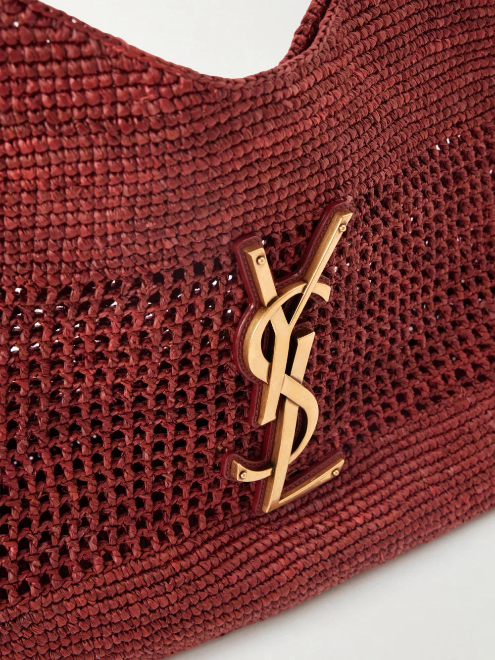 Close-up detail of the Saint Laurent Icare Maxi Leather-trimmed Raffia Tote