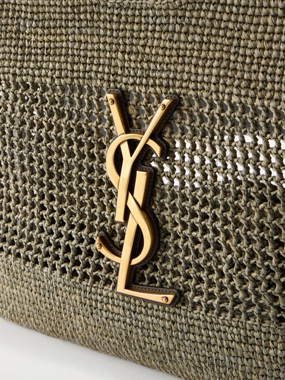 Close-up detail of the Saint Laurent Icare Maxi Leather-trimmed Raffia Tote
