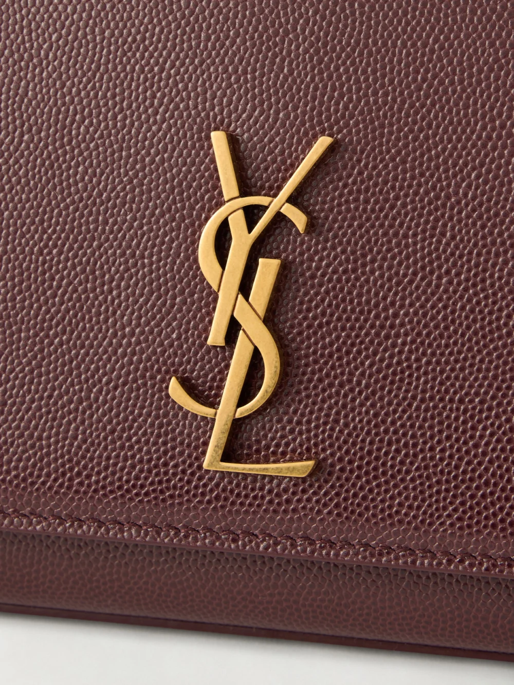 Close-up detail of the Saint Laurent Kate Embossed-leather Clutch