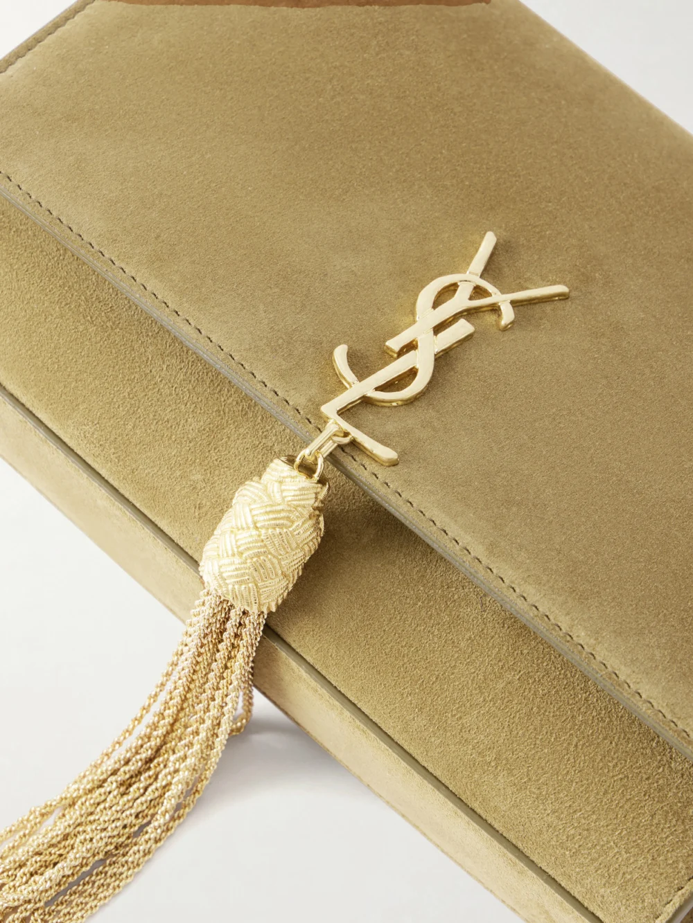 Close-up detail of the Saint Laurent Kate Tassel Small Cassandre-embellished Suede Shoulder Bag