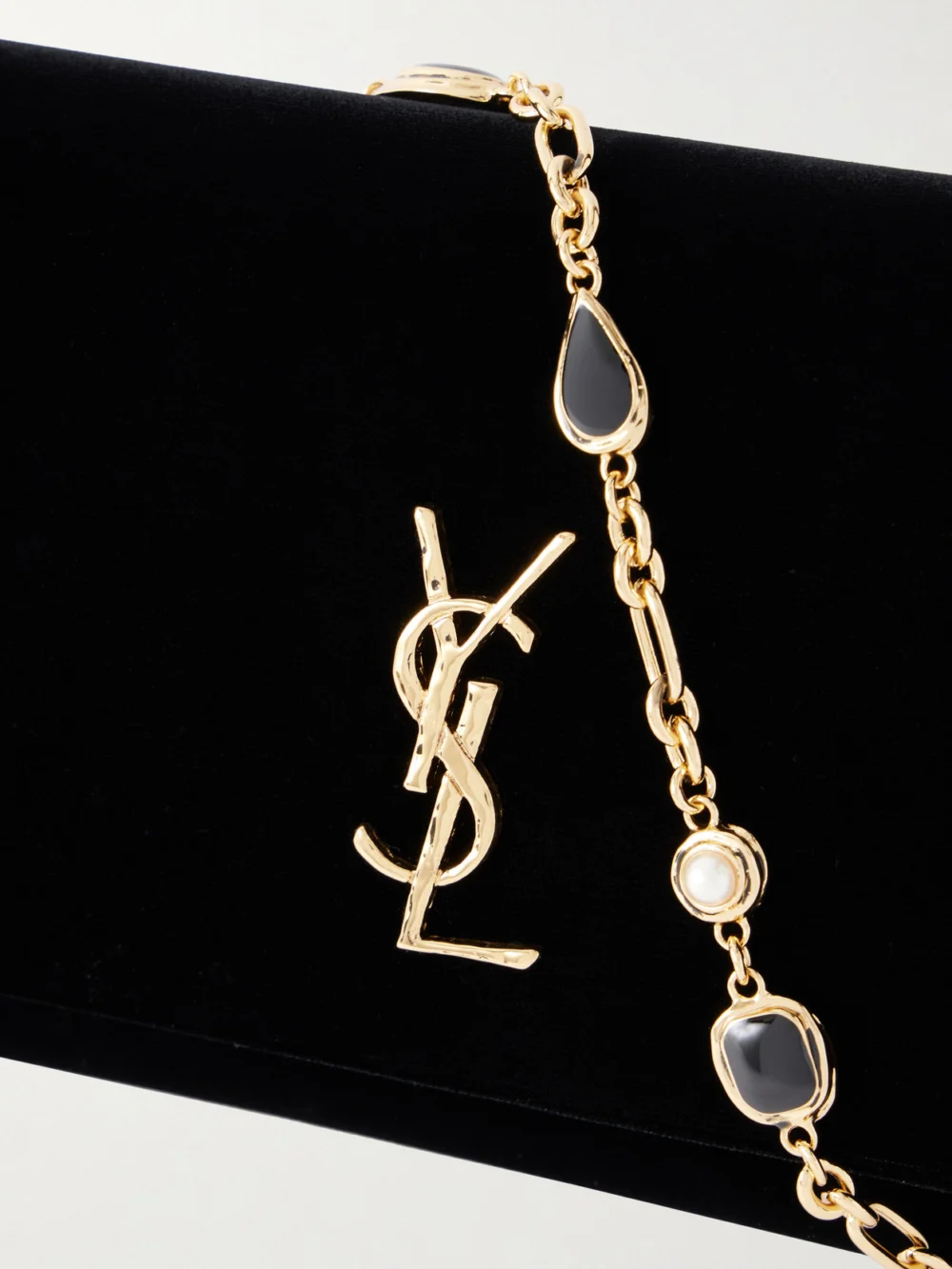 Close-up detail of the Saint Laurent Kate Velour Logo Chain Clutch