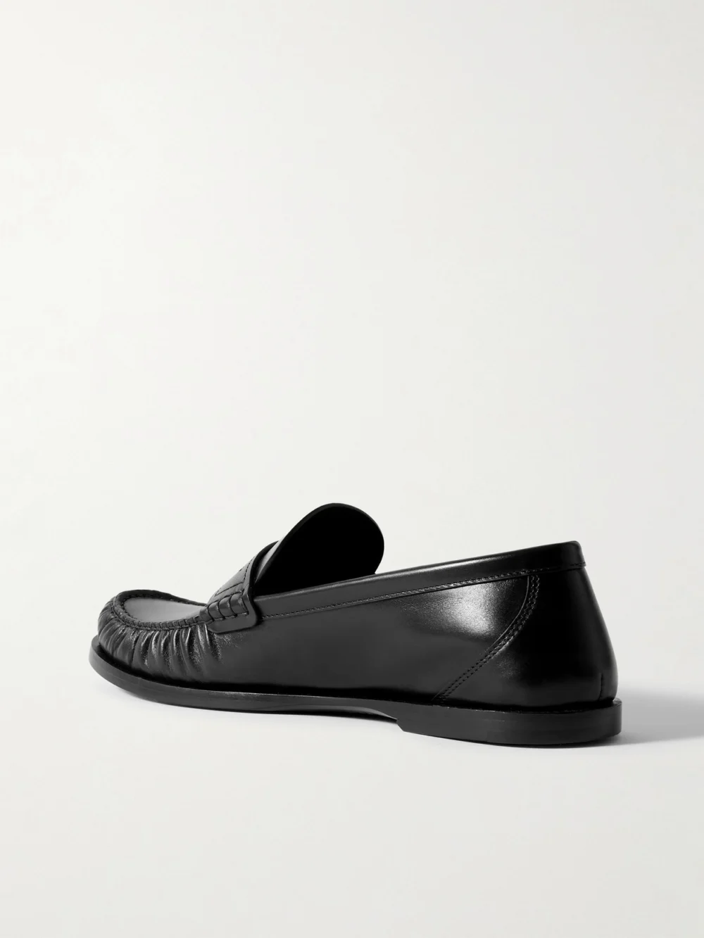 Back view of the Saint Laurent Laurent Cassandre-embellished Glossed-leather Loafers