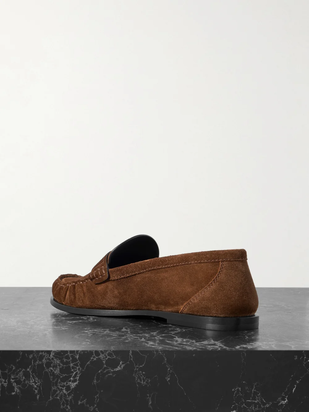 Back view of the Saint Laurent Laurent Cassandre-embellished Suede Penny Loafers