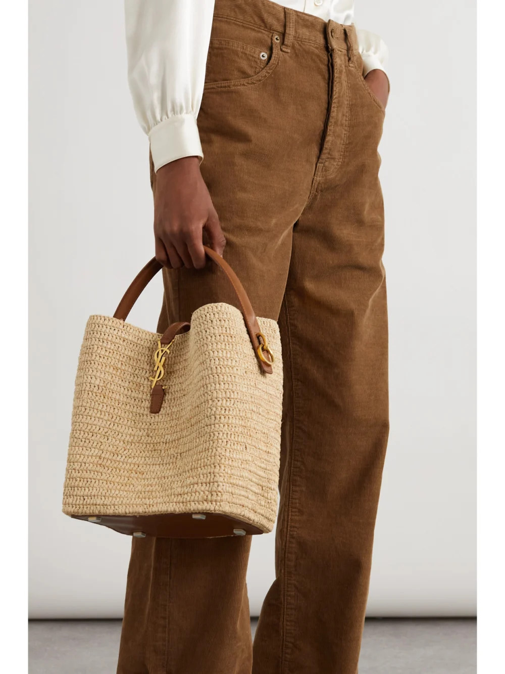 Saint Laurent Le 37 Leather-trimmed Raffia Bucket Bag, styled view