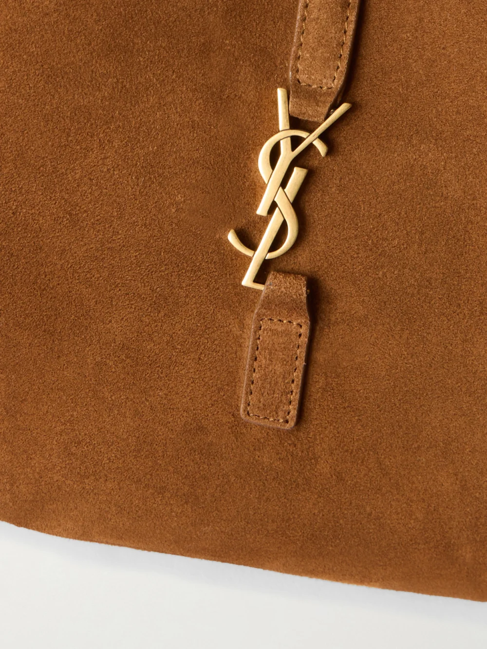 Close-up detail of the Saint Laurent Le 5 À 7 Baby Bea Suede Top-handle Bag