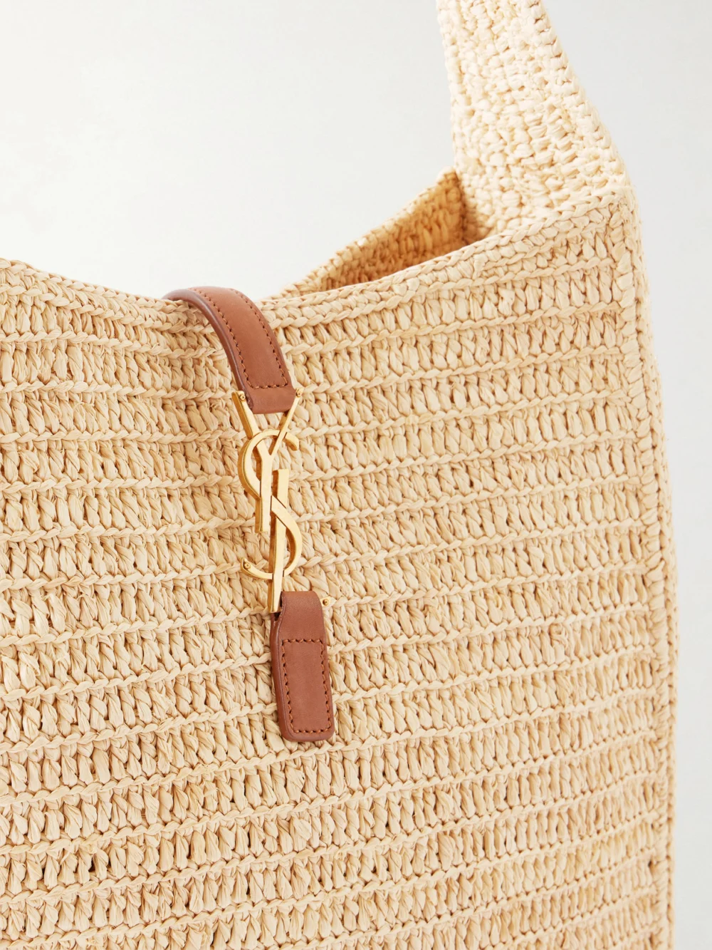 Close-up detail of the Saint Laurent Le 5 À 7 Leather-trimmed Raffia Shoulder Bag