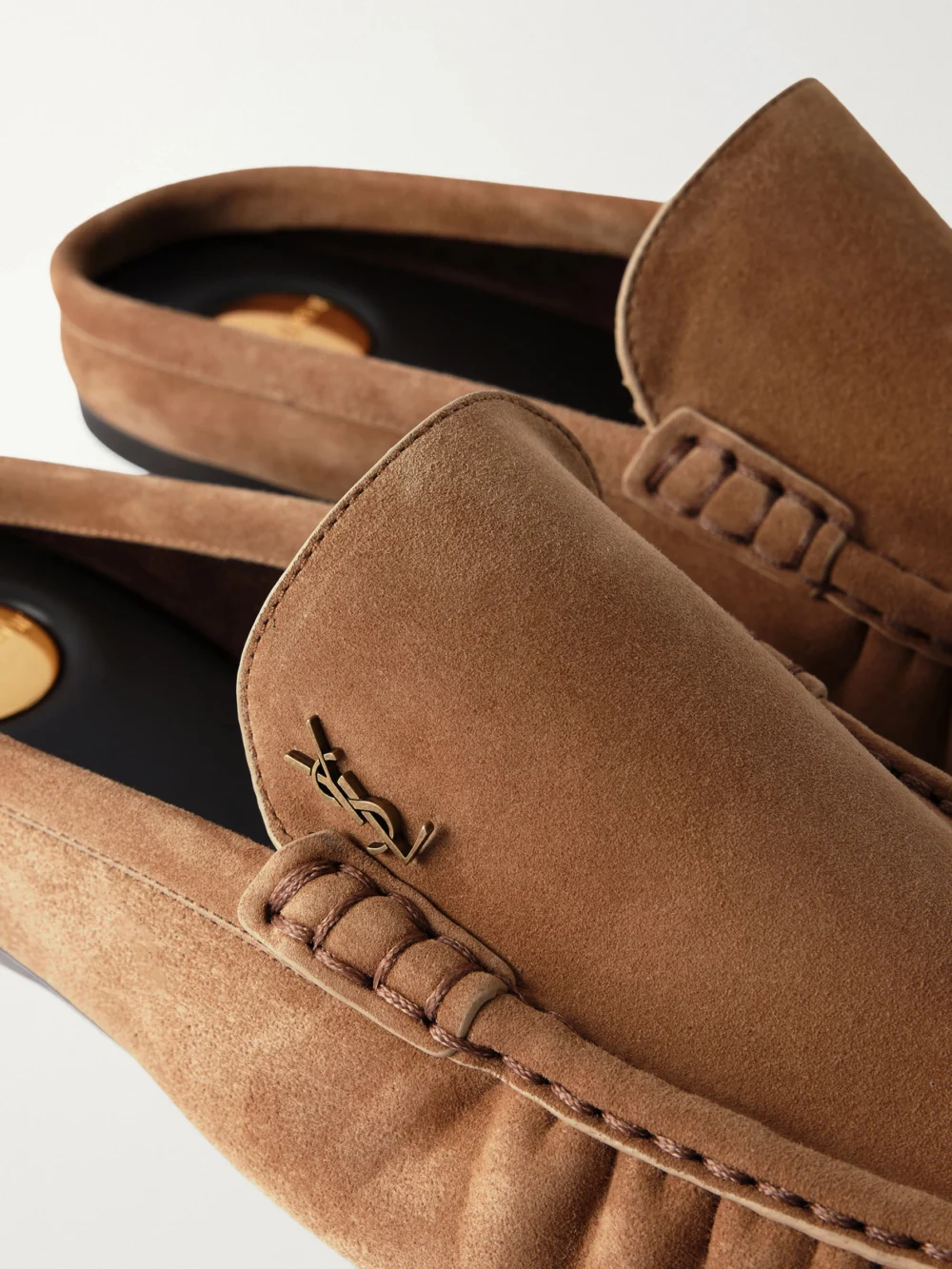 Close-up detail of the Saint Laurent Le Loafer 05 Cassandre-embellished Suede Mules