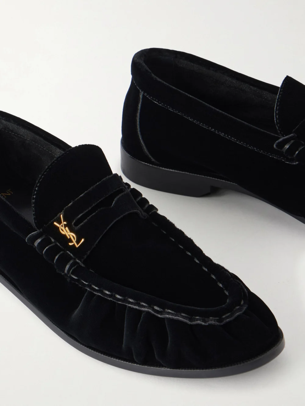 Close-up detail of the Saint Laurent Le Loafer 05 Cassandre-embellished Velvet Loafers
