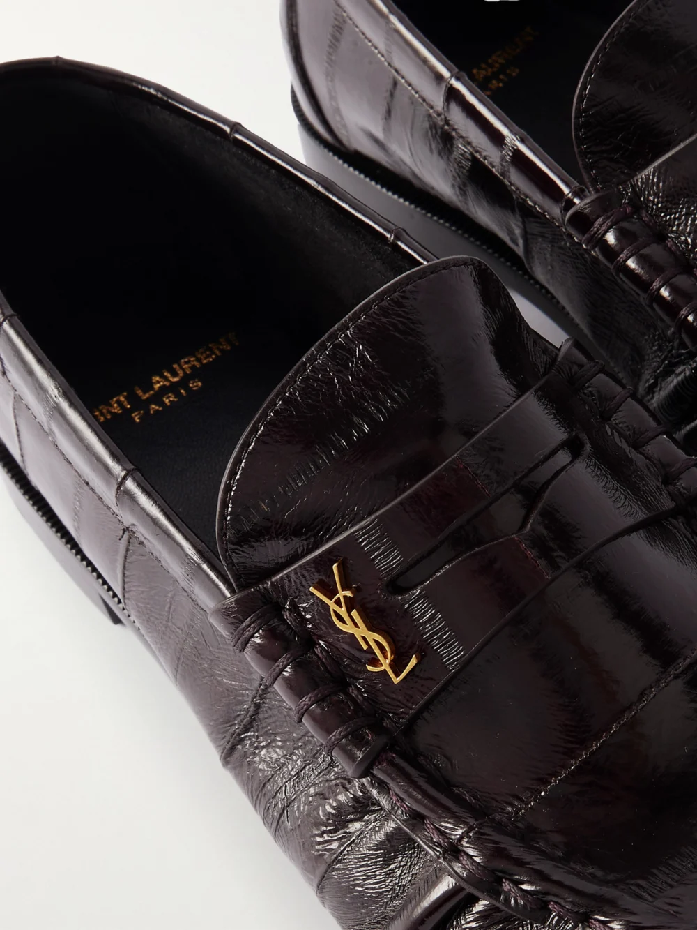 Close-up detail of the Saint Laurent Le Loafer Cassandre-embellished Eel Loafers