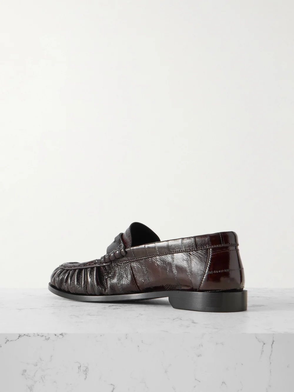 Back view of the Saint Laurent Le Loafer Cassandre-embellished Eel Loafers