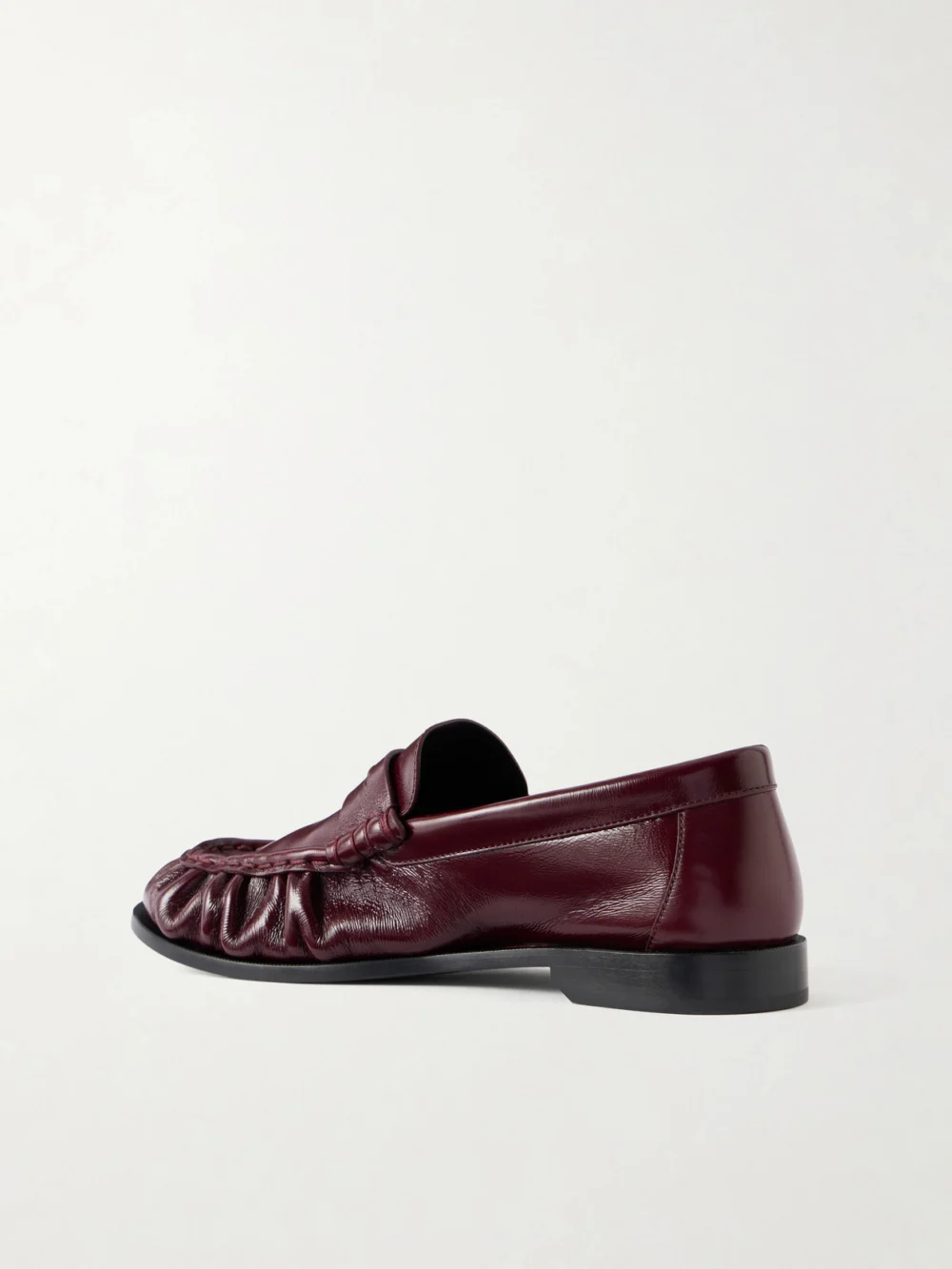 Back view of the Saint Laurent Le Loafer Cassandre-embellished Glossed-leather Loafers