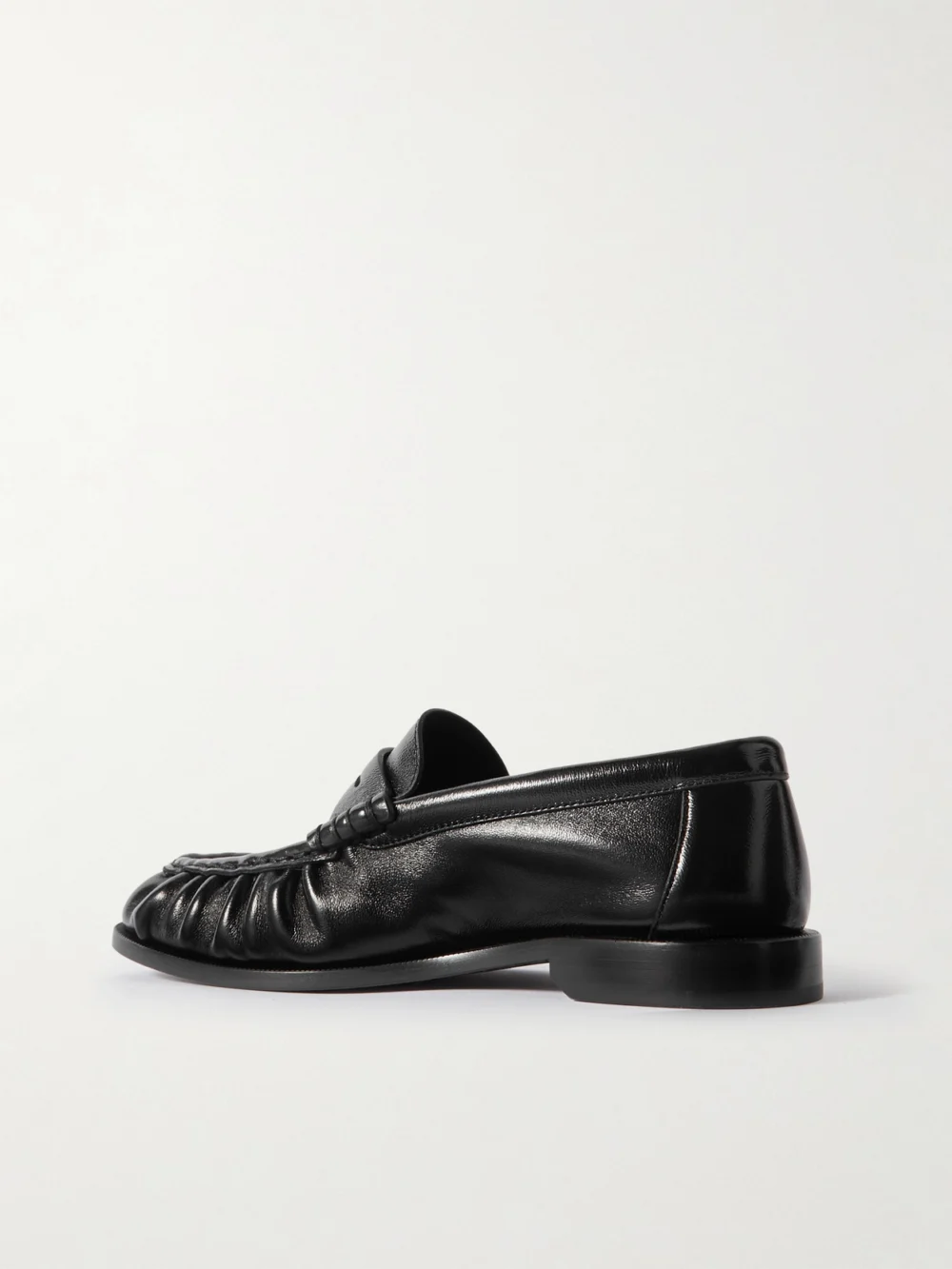 Back view of the Saint Laurent Le Loafer Cassandre-embellished Leather Loafers