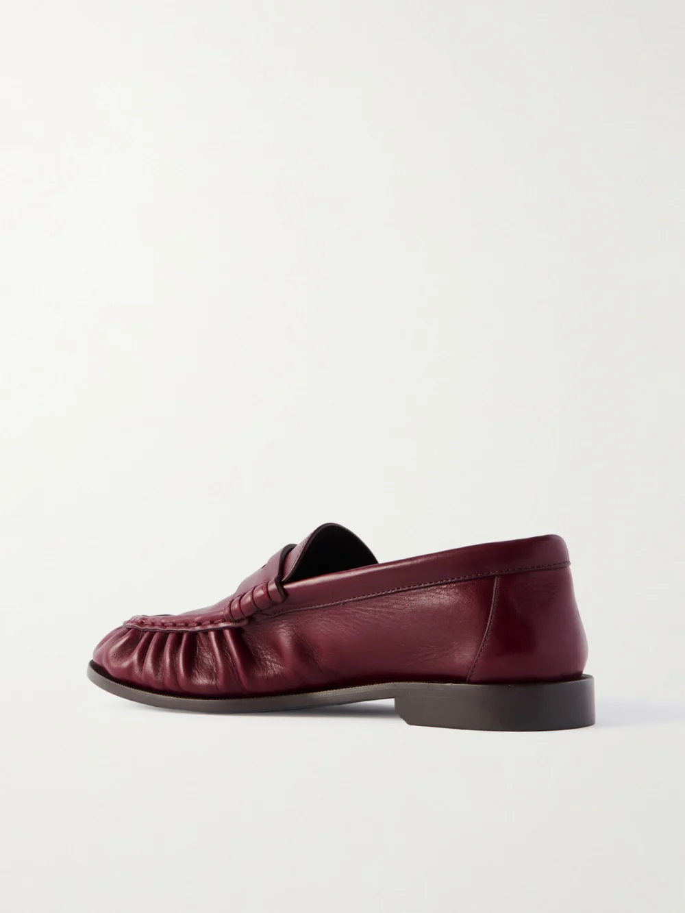 Back view of the Saint Laurent Le Loafer Cassandre-embellished Leather Loafers