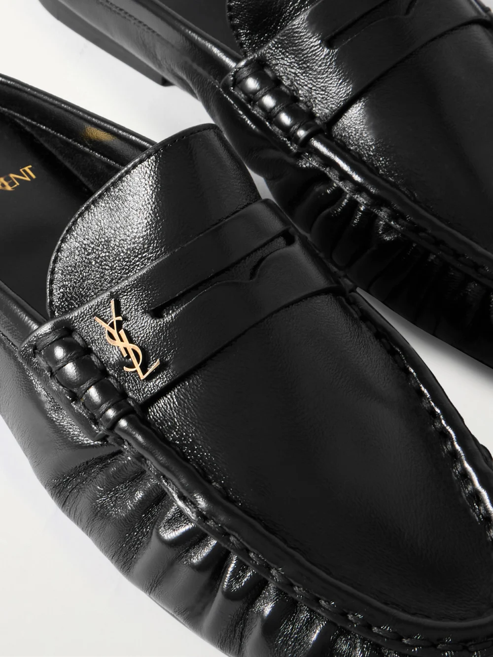 Close-up detail of the Saint Laurent Le Loafer Cassandre-embellished Mules