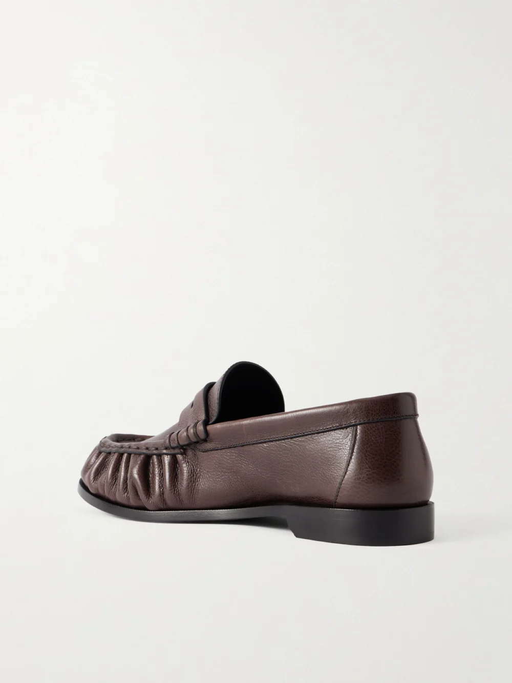 Back view of the Saint Laurent Le Loafer Cassandre-embellished Textured-leather Loafers