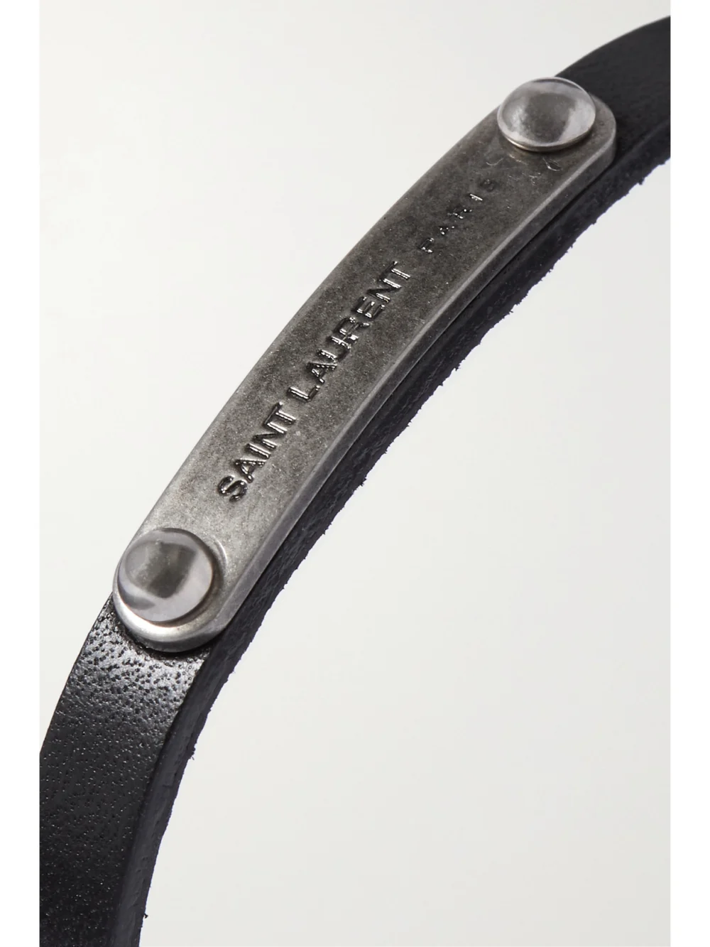 Close-up detail of the Saint Laurent Leather and Silver-tone Bracelet