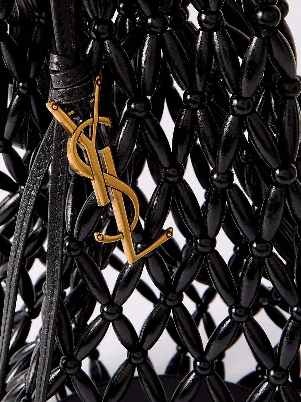 Close-up detail of the Saint Laurent Leather-trimmed Beaded Wood Tote