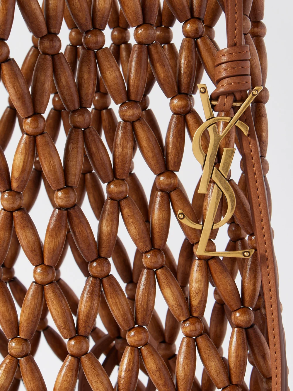 Close-up detail of the Saint Laurent Leather-trimmed Beaded Wood Tote