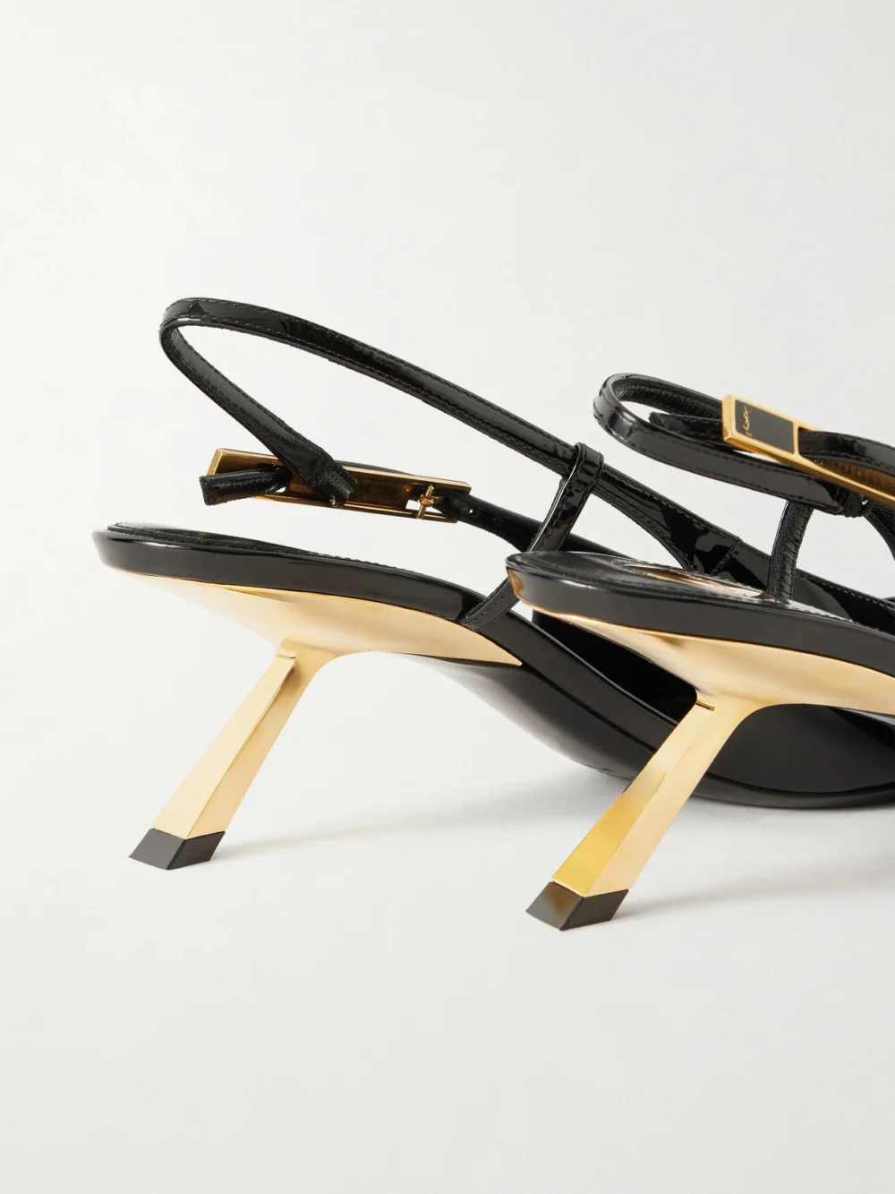 Close-up detail of the Saint Laurent Lee Patent-leather Slingback Pumps