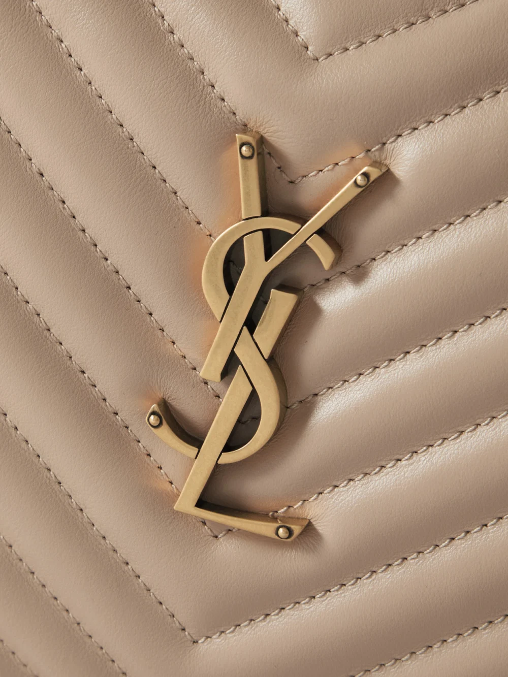 Close-up detail of the Saint Laurent Loulou Medium Matelassé Leather Shoulder Bag
