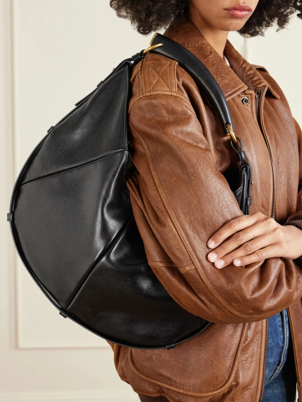 Saint Laurent Mombasa Paneled Leather Shoulder Bag, styled view