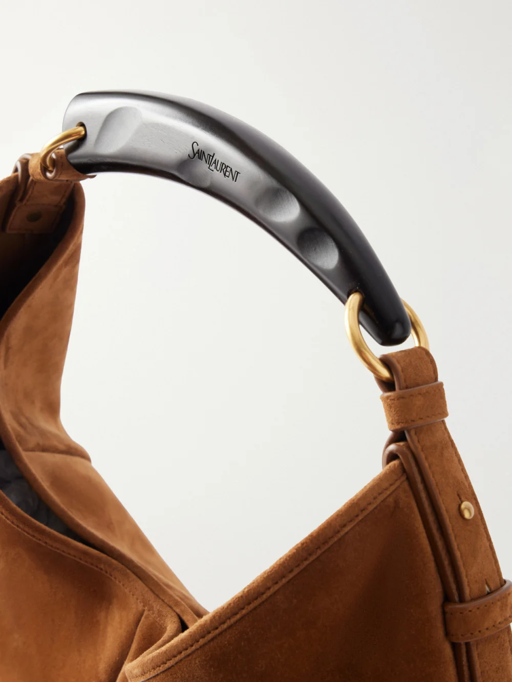 Close-up detail of the Saint Laurent Mombasa Paneled Leather-trimmed Suede Shoulder Bag